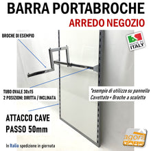 Carica l&#39;immagine nel visualizzatore di Gallery, BARRA PORTABROCHE PER GANCI/BROCHE PORTABITI PER NEGOZIO ATTACCO CAVETTATO PASSO 50MM CROMATA LARGHEZZA 60 CM  Attacco piantana cavettata con cave passo P50mm (passo 5cm) realizzata in tubo ovale cromato alto spessore con staffe 2 denti regolabili su 2 posizioni.  Larghezza modulo L595mm nominale 60 (esposizione abiti 60 cm)
